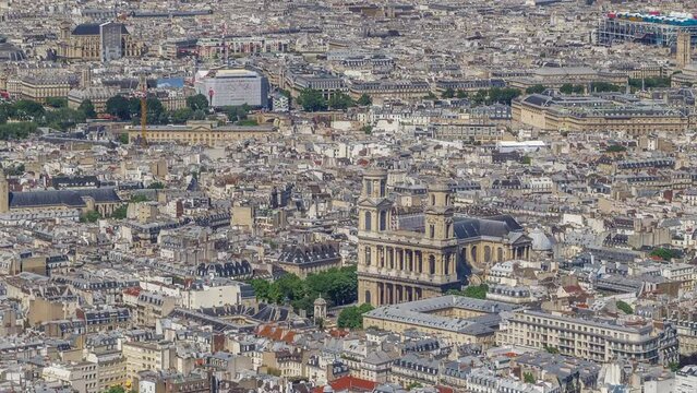 Top view of Paris skyline from above timelapse. Landmarks of european megapolis with Church of Saint-Sulpice. Bird-eye view from observation deck of Montparnasse tower. Paris, France