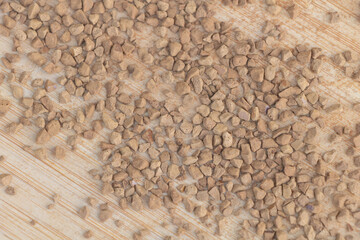 Coffee granules on a wooden background. Close up