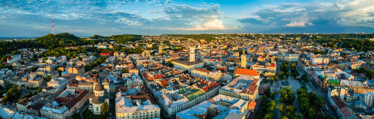 Obraz premium Rooftops of the old town in Lviv in Ukraine. The magical atmosphere of the European city. Landmark, the city hall and the main square. Drone photo.