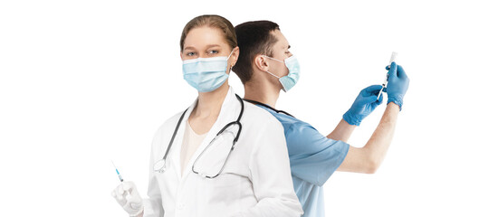 Vaccination Concept. Male And Female Doctors Wearing Medical Masks Holding Syringes - Powered by Adobe
