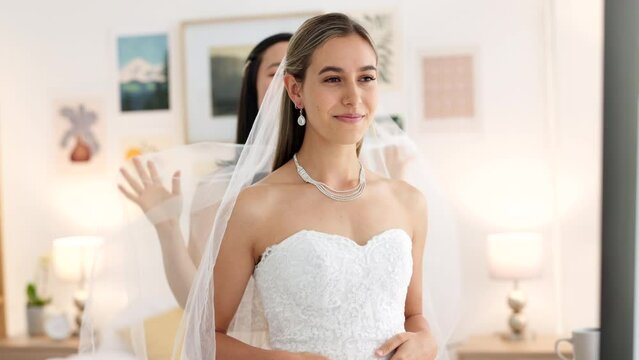 Bride, wedding and woman helping with veil in dressing room smile for special day. Happy women love and bridesmaid support or helping bride with fabric head piece for beauty, marriage and happiness