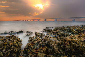 The Zeelandbrug photographed at sunrise with oyster sahore - 585936502