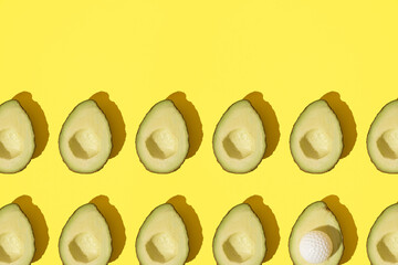 Two halves of a avocado with a golf ball. Pattern.