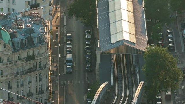 Top view of Paris skyline with metro line station from above timelapse. Main landmarks of european megapolis with Boulevard de Grenelle at sunset. Bird-eye view from observation deck. Paris, France