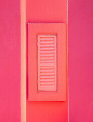 pink wall with a window 