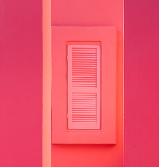 pink wall with a window blind
