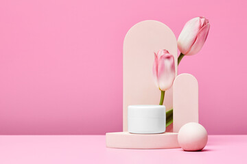 podium with pink tulips and arch on pink background.