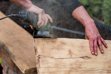A carpenter works in a garden.