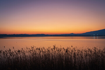 Naklejka na ściany i meble Pusiano lake at the sunset