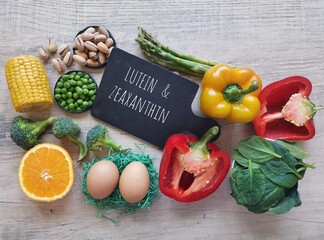 Foods rich in lutein and zeaxanthin, two carotenoids. Fresh vegetable as best food sources of lutein and zeaxanthin. Spinach, broccoli, peas, corn, bell pepper, asparagus, pistachios, carrot...