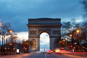 The Triumphal Arch in rainy evening, Paris, France.