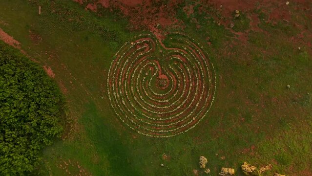 Artistic hedge maze seen from a top down drone view.