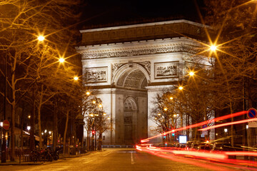 The Triumphal Arch in rainy evening, Paris, France.