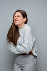 Period or stomach pain. Woman isolated portrait.