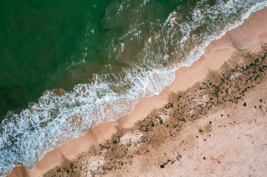 Aerial view to surf at the green sea
