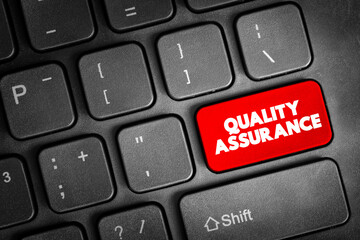 Quality Assurance - systematic process of determining whether a product or service meets specified requirements, text button on keyboard - obrazy, fototapety, plakaty