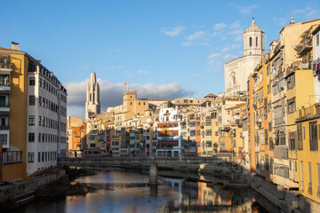 A view of the Riu Onyar in Girona Spain with the Cathedral of Girona in the background