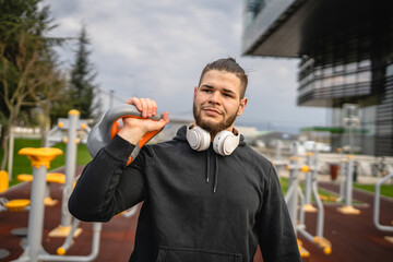 Man young adult caucasian male with kettlebell girya weight portrait