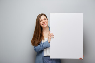 Smiling business woman holding white sign board. - 585961928