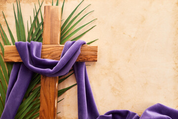 Palm sunday background. Cross and palm on vintage background.