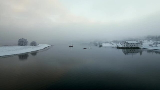 Norwegian Fjord on winter day, Kvaloya in Norway. Aerial drone