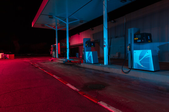 abandoned Gas station at night with cold and hot lights