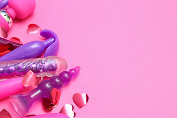 Obraz na płótnie Canvas Different sex toys on pink background, closeup