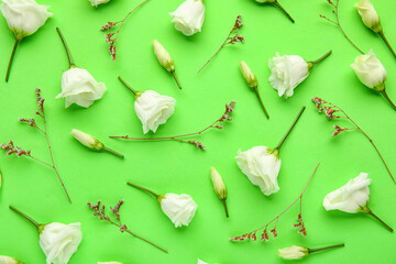 Composition with delicate eustoma flowers on green background