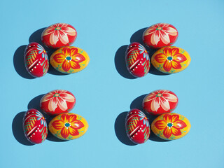 Groups Hand painted easter eggs on blue background