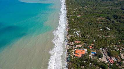 aerial coast palomino vist with waves - obrazy, fototapety, plakaty