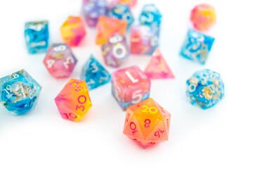 Multicolored resin dice on white surface
