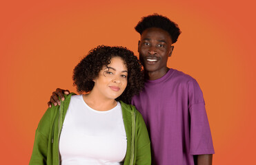 Obraz premium Portrait of beautiful multiracial couple, embracing, smiling at camera