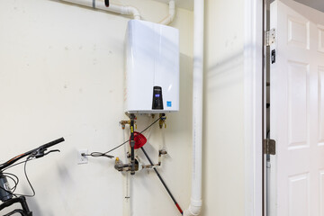 tankless water heater in attached garage - Powered by Adobe