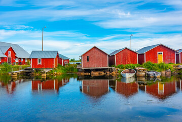 Red timber boat houses at Svedjehamn in Finland