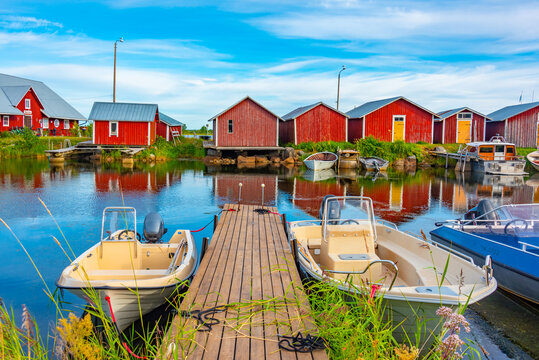 Red timber boat houses at Svedjehamn in Finland