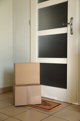 Parcels delivered on mat near front door