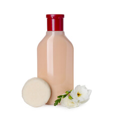 Solid shampoo bar and bottle of cosmetic product on white background