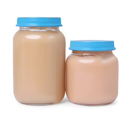 Glass jars with healthy baby food isolated on white