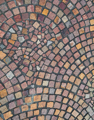 Multicolored Square Brick Tiled Roadway with Charcoal Gray Mortar.