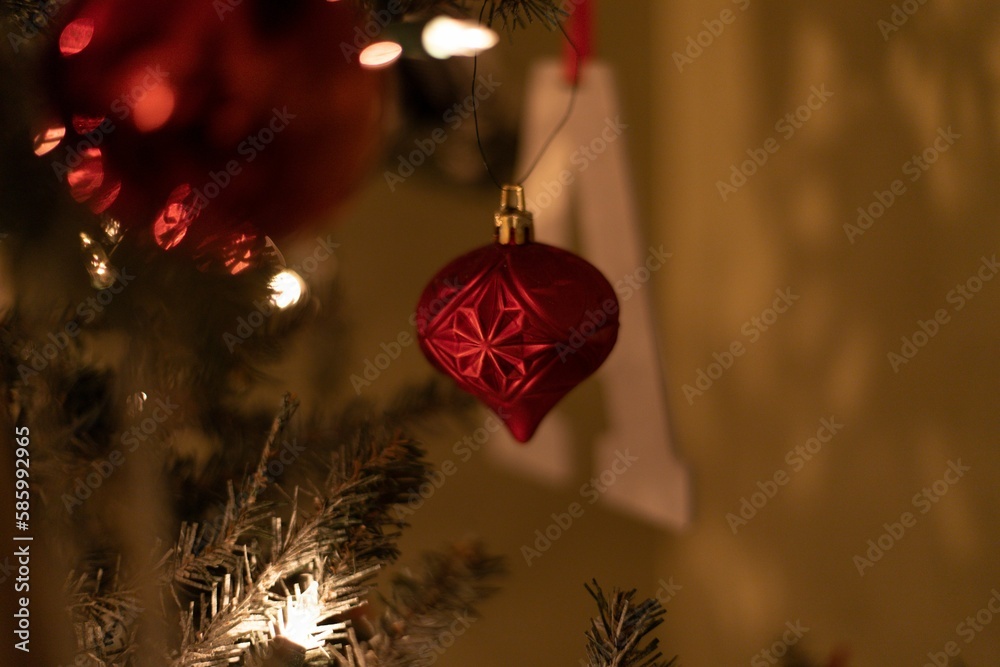 Sticker red ornaments adorn the christmas tree