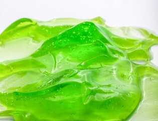 Closeup shot of a green gel texture of aloe.