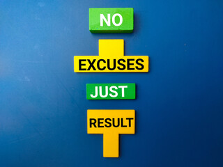 Colored wooden block with the word NO EXCUSES JUST RESULT  on blue background.