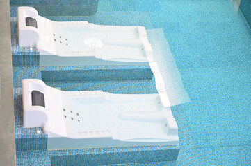 hydrotherapy and hydromassage in the blue swimming pool, healthcare industry