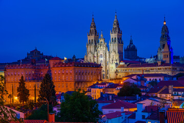 Night panorama view of the Cathedral of Santiago de Compostela in Spain - obrazy, fototapety, plakaty