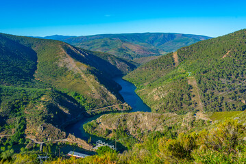 Panorama of Navea river passing Pontenovo hydro power plant in Spain
