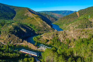 Panorama of Navea river passing Pontenovo hydro power plant in Spain