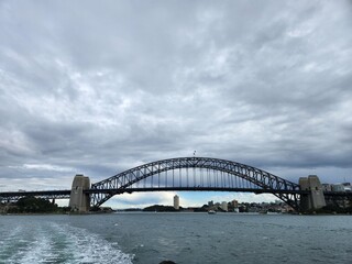 Sydney harbour bridge covered in clouds