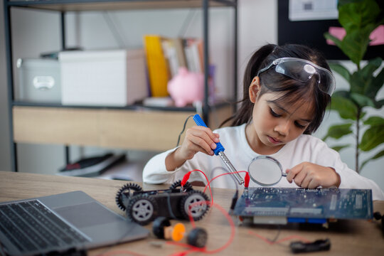 Asia students learn at home in coding robot cars and electronic board cables in STEM, STEAM,