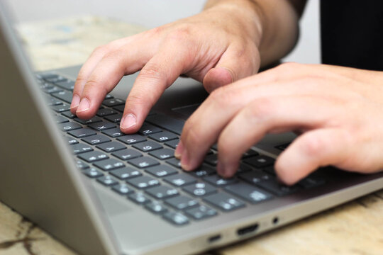Man working from the comfort of his home-person carrying out teleworking activities-person undertaking from home