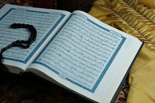 Reading Alqur'an, Qur'an, kuran or Islamic holy book at Ramadhan kareem,  eid mubarak or islamic concept
